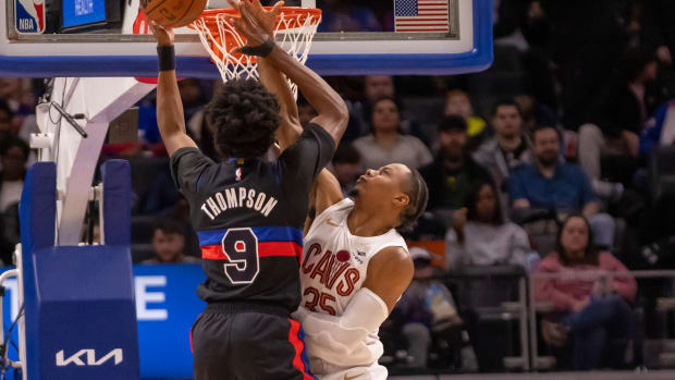 Dec 2, 2023; Detroit, Michigan, USA; Detroit Pistons forward Ausar Thompson (9) drives to the basket as Cleveland Cavaliers forward Isaac Okoro (35) defends during the first half at Little Caesars Arena. Mandatory Credit: David Reginek-USA TODAY Sports
